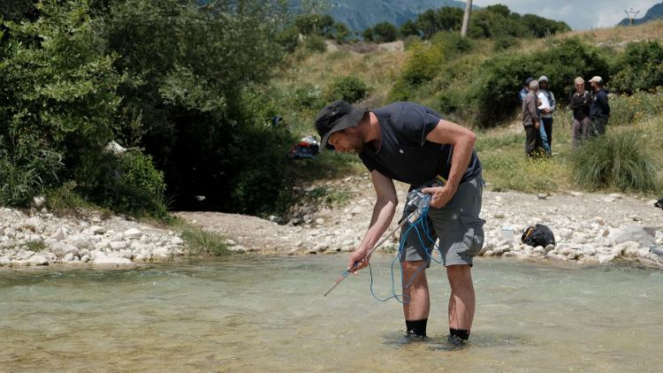 Professor Gabriel Singer (University of Innsbruck) at the Shushica river taking water samples for providing further evidence that the river network of the Vjosa catchment needs the best protection possible. © Nick St.Oegger